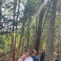 Beaver Island Participants in a group in the woods, smiling